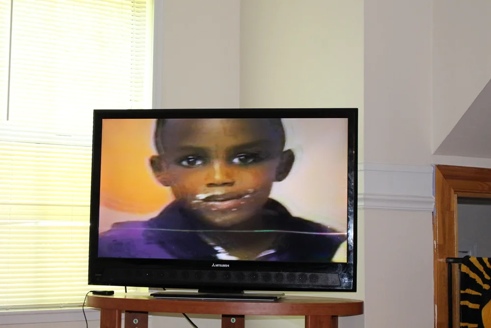 A childhood portrait on a television