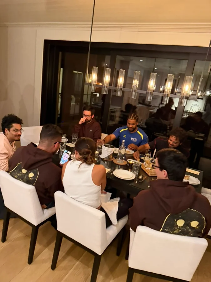 Friends gathered around a dinner table